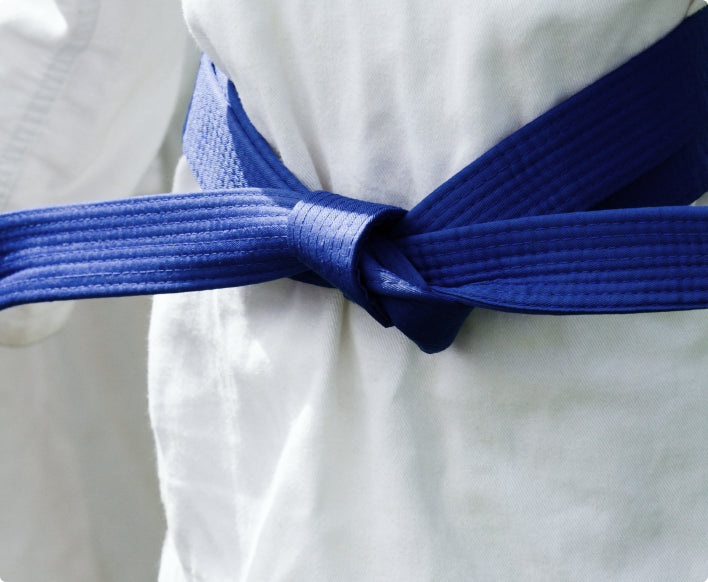 Martial artist wearing blue belt