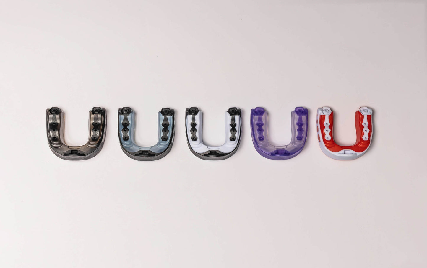 5-pack of assorted dual and tri-color deluxe mouth guards with case