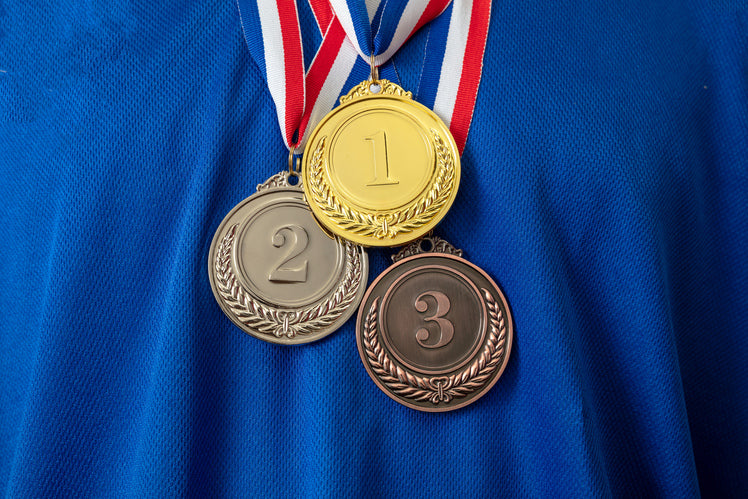 Gold, silver, and bronze medals with blue background