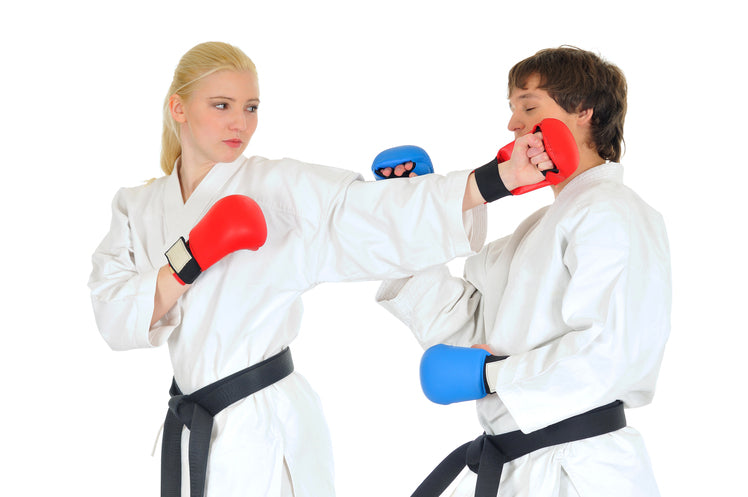 Two martial artists sparring with gloves